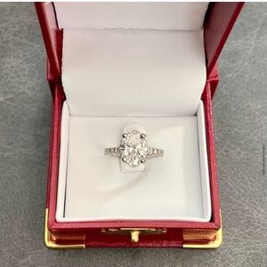2.64 carat Oval Engagement ring and diamond wedding band.